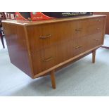 A mid 20thC mahogany dressing chest with two long and three short drawers,