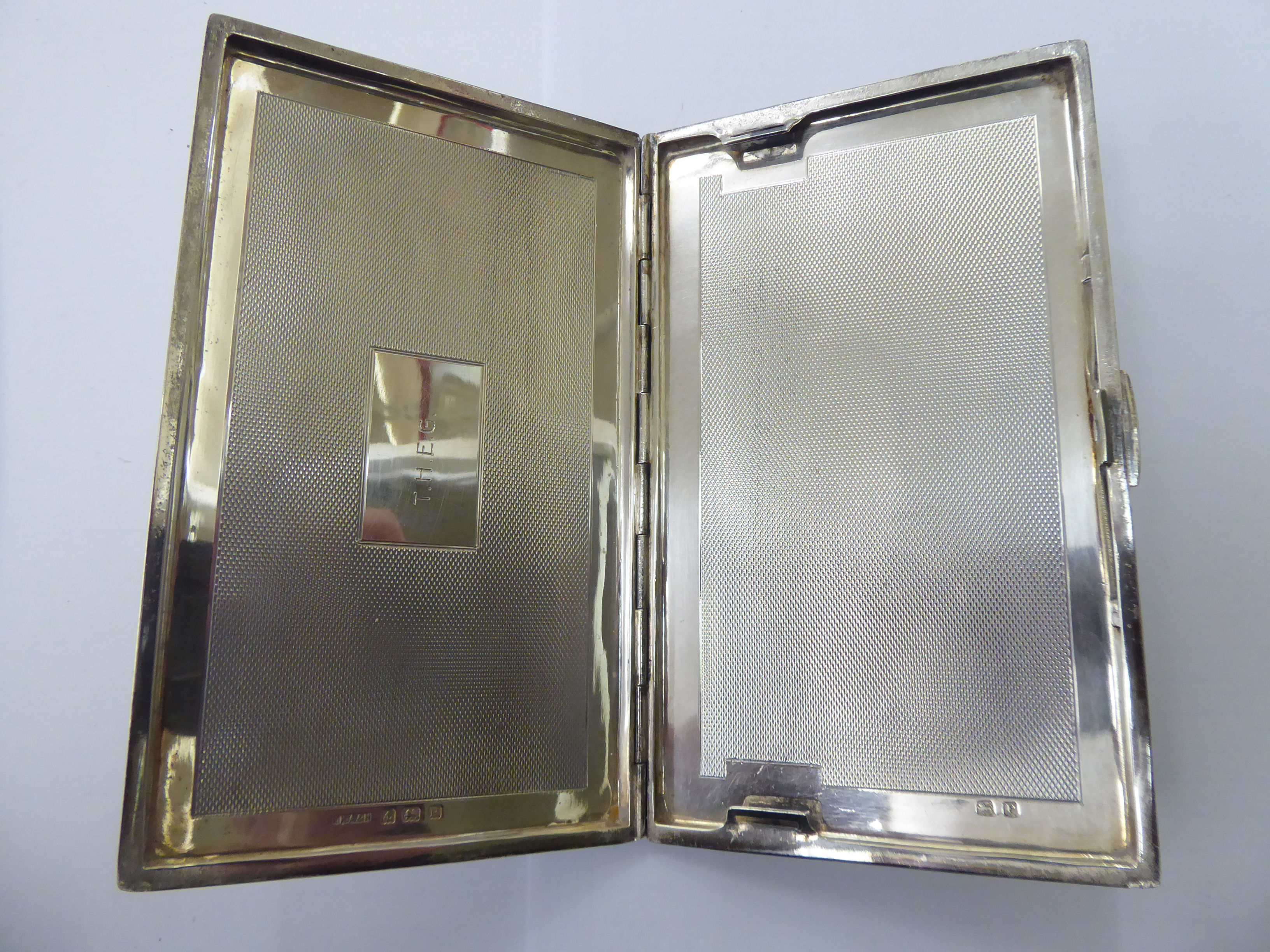 A silver folding cigarette case with engine turned decoration Birmingham 1918 11 - Image 2 of 2
