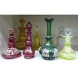 Eight various late 19th/early 20thC glass dressing table decanters of differing colours and forms: