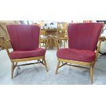 A pair of Ercol beech and elm framed, spindle back, open arm chairs,