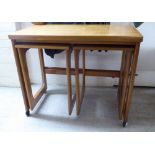 A nesting set of three modern teak occasional tables,