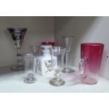 A mixed collection of late 19th/early 20thC drinking glasses: to include a cranberry coloured