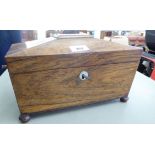 An early rosewood tea caddy of sarcophagus form,