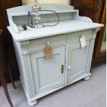 An early 20thC light blue painted pine washstand with two frieze drawers, over two panelled doors,