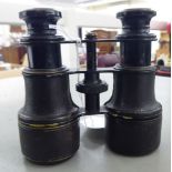 A pair of early 20thC hide covered binoculars OS10