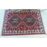 A Shiraz rug with two hexagonal medallions,