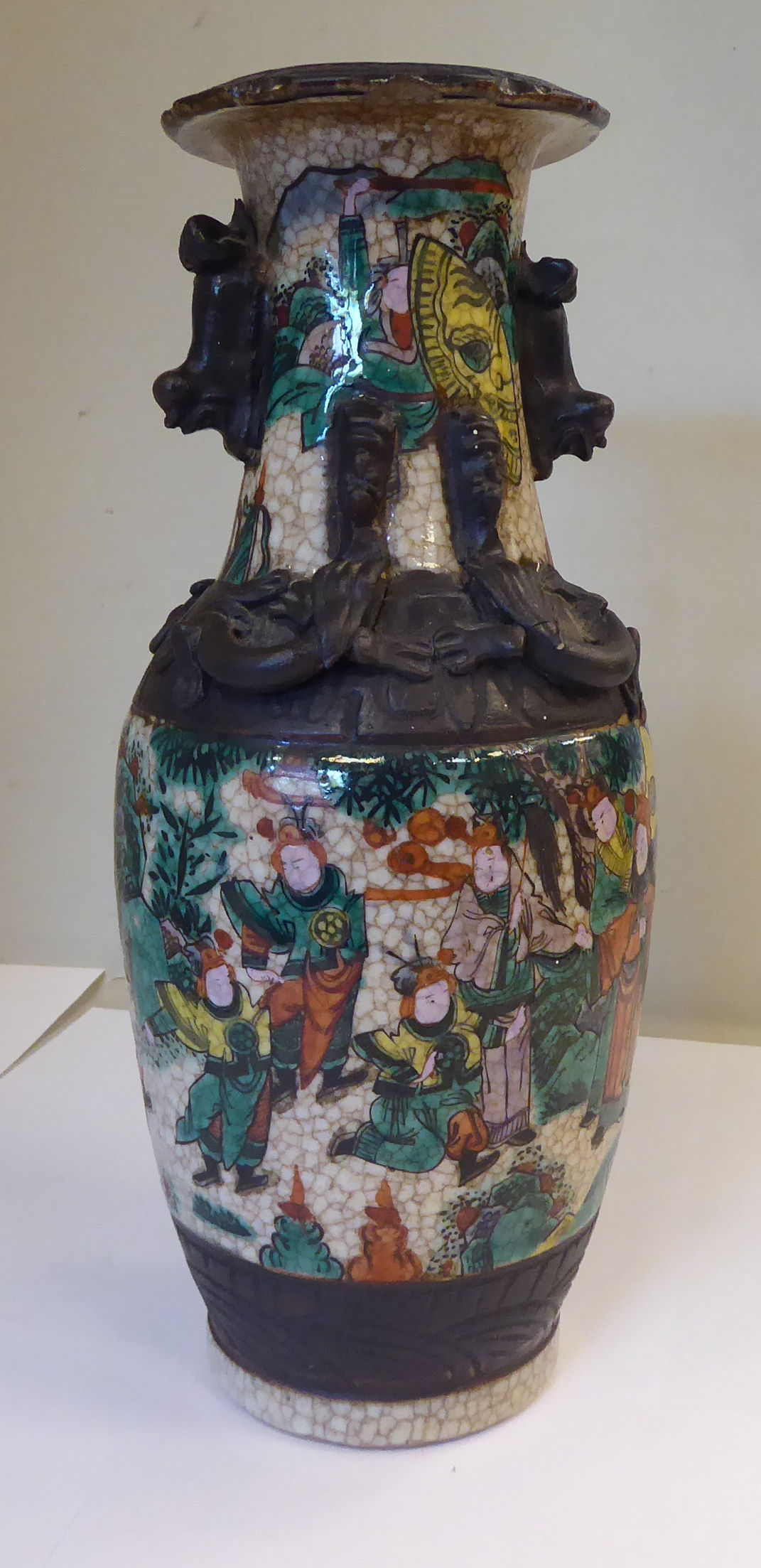 A 20thC Chinese crackle glazed and simulated bronze porcelain vase of baluster form,