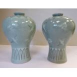 A pair of 20thC Chinese celadon glazed porcelain vases of tapered, waisted, baluster form,