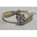 A 9ct gold ring, daisy set diamond,