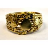 A gold coloured metal wire band ring,