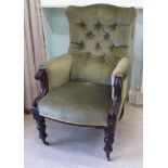 A mid 19thC mahogany showwood framed armchair, the green part button upholstered back,
