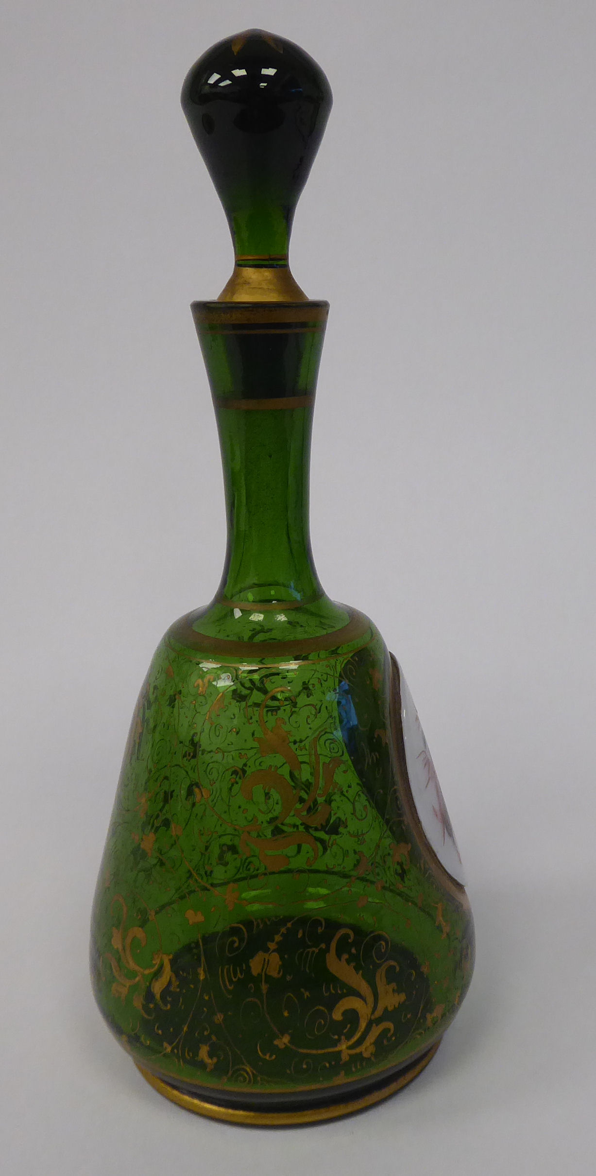 A late 19thC Bohemian decoratively gilded, green glass, mallet shaped dressing table decanter, - Image 4 of 7