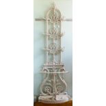A mid Victorian white painted cast iron hallstand, featuring foliage and scrolls,
