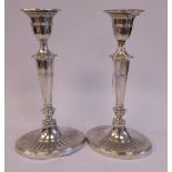 A matched pair of late Victorian silver candlesticks of oval outline with fluted and wire ornament,