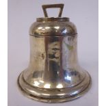 A silver bell design inkwell with an outset hinged lid and glass reservoir,