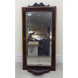 A late 19thC string inlaid rosewood mirror,