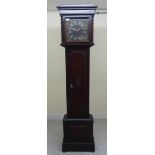 A 1920s Grandmother clock, in a stained oak case,