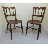 A set of three late 19thC country made, beech and elm framed Windsor chairs with level,