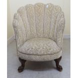 A late Victorian salon chair with a shell shaped,