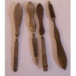 Four silver handled manicure instruments mixed marks