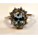 An 18ct white gold ring, claw set with an aquamarine,