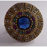 A Turkish bi-coloured silver ring with blue, white, green and red stones, in a radiating setting,