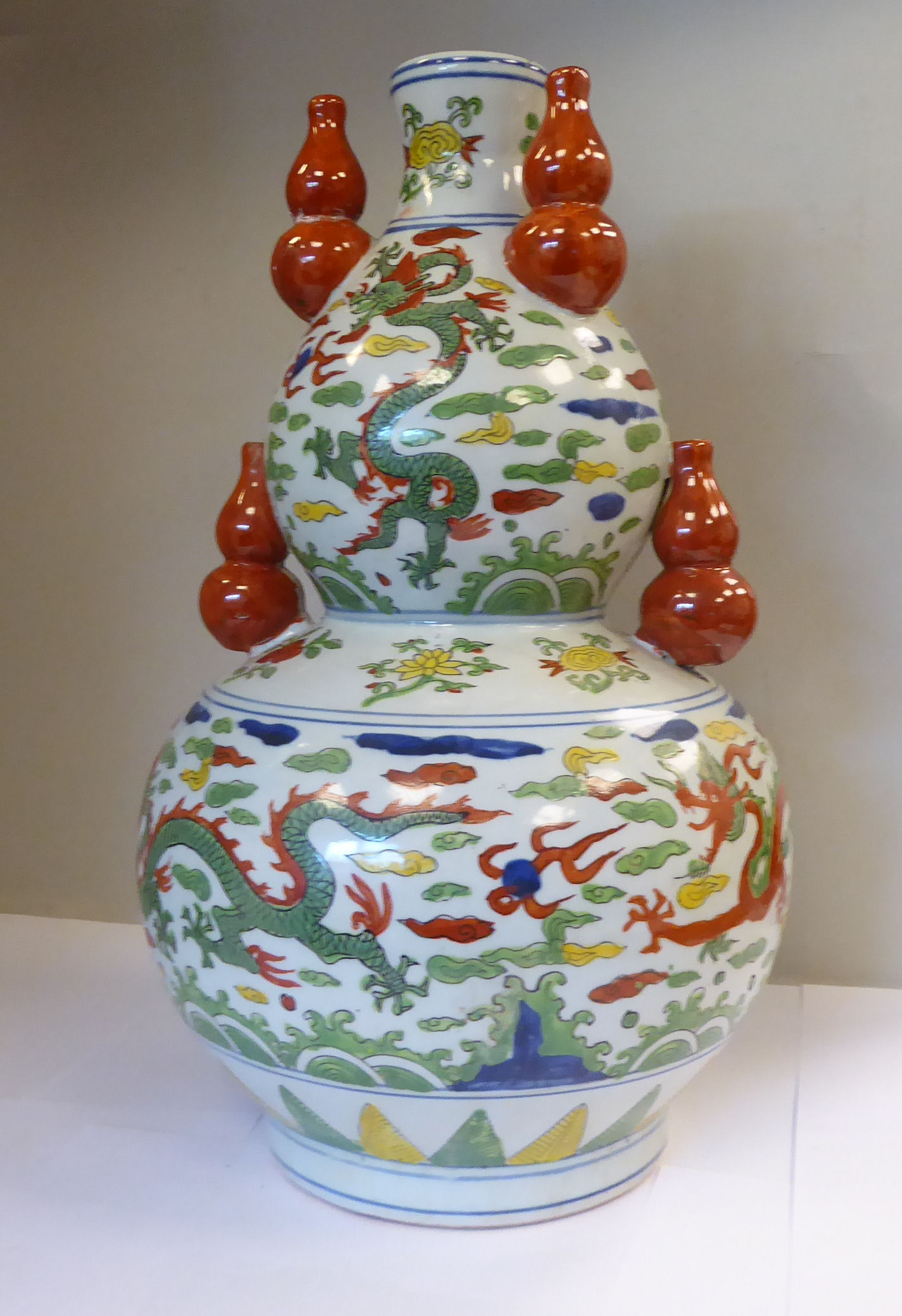 An early 20thC Japanese porcelain double gourd shaped vase, surmounted by five smaller vases, - Image 3 of 7