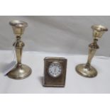 A pair of loaded silver candlesticks with tapered stems 5.