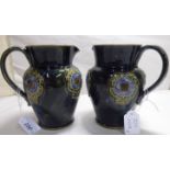 Two similar Art Nouveau period Royal Doulton stoneware jugs,