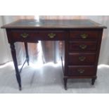 An Edwardian mahogany desk, the top set with a black hide scriber,