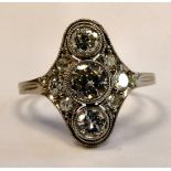 An 18ct white gold three stone diamond ring