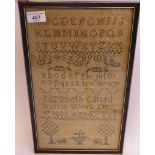 A William IV sampler, featuring Arabic numerals and alphabet letters, trees and dogs,