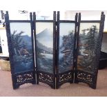 An early 20thC Japanese stained and carved wooden framed and panelled four-fold screen,