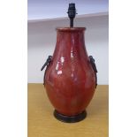 A 20thC Chinese streaky red glazed, china vase design table lamp of ovoid form with applied,