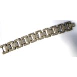 A white coloured gold diamond set, open rectangular link bracelet,