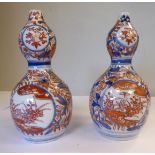 A pair of early 20thC Japanese Imari porcelain double gourd shaped vases,