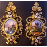A pair of gold coloured metal and seed pearl set oval drop earrings,
