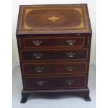 An Edwardian string and ebony inlaid mahogany bureau, the fall flap with marquetry ornament,