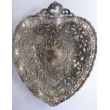 A late Victorian silver heart shaped basket, decoratively cast, pierced and chased with latticed,