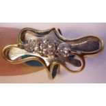 A gold coloured metal freeform ring,