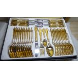 An SBS Bestoke Solingen gold plated steel canteen on flatware and cutlery,