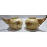 A pair of early 20thC Royal Worcester blush ivory glazed china vases of squat, bulbous form,