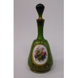 A late 19thC Bohemian decoratively gilded, green glass, mallet shaped dressing table decanter,
