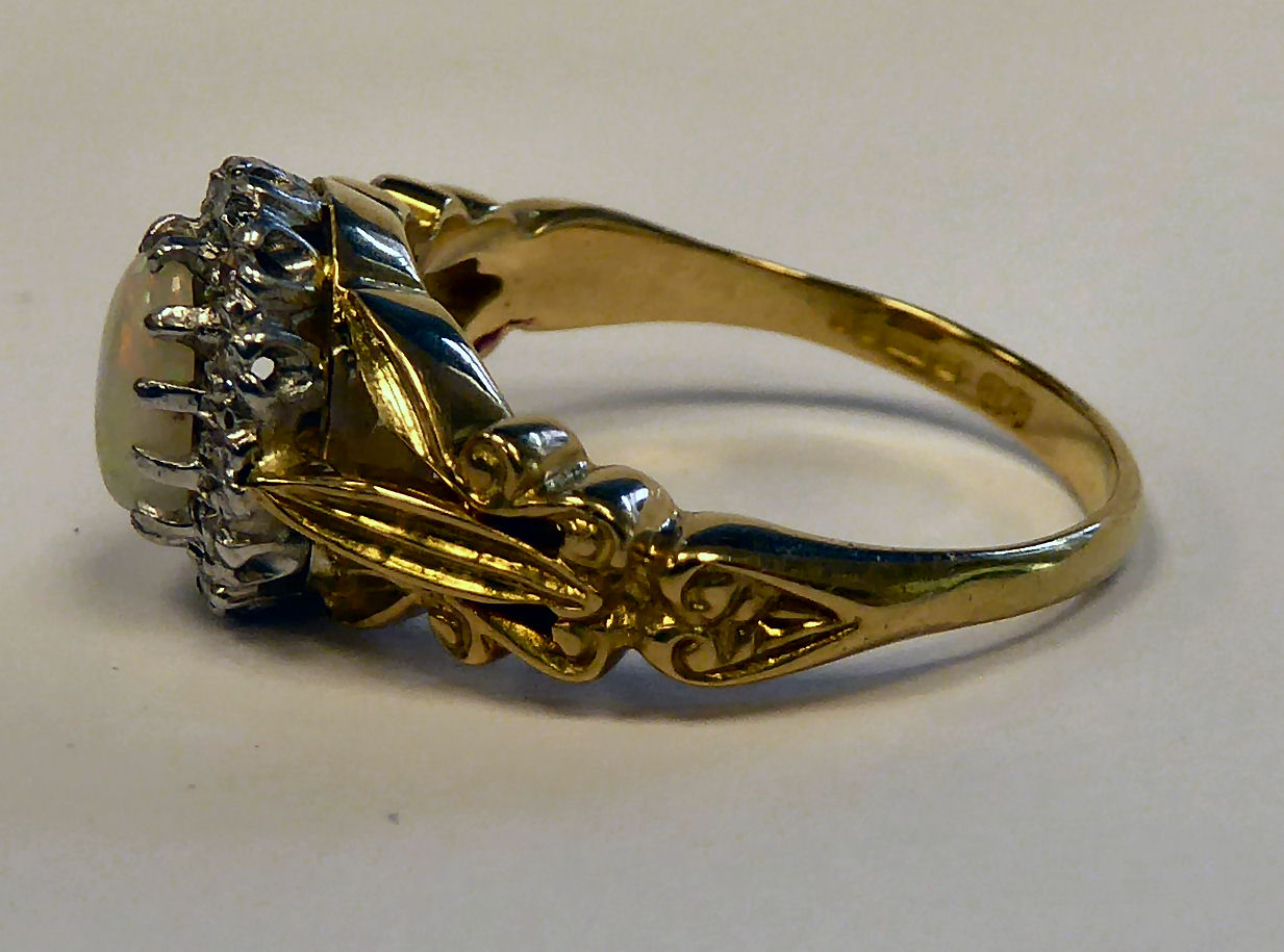 An 18ct gold ring, claw set with an opal, surrounded by diamonds, - Image 2 of 4