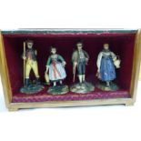 A set of four Tyrolean carved and painted figures, representing artisan occupations,