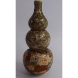 An early 20thC Satsuma earthenware triple gourd shaped vase,