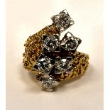 A textured gold coloured metal wrap over ring,