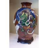A late 19th/early 20thC Japanese high fired porcelain vase of baluster form,