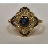 A gold coloured metal cluster ring,