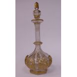 A late 19thC Continental cut and decoratively gilded liqueur decanter of squat, bulbous,
